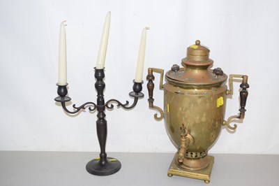 Lot 160 - A candelabra and a brass tea urn