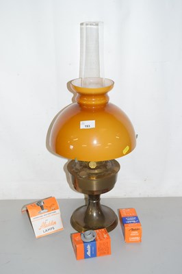 Lot 193 - A brass based oil lamp
