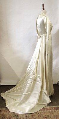 Lot 33 - A 1960's wedding dress, in cream satin with...