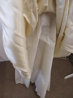 Lot 33 - A 1960's wedding dress, in cream satin with...