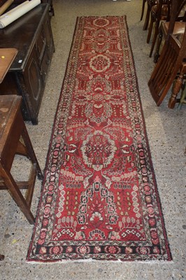Lot 296 - 20th Century red patterned runner carpet