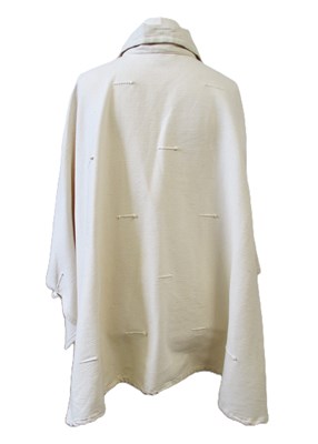 Lot 80 - A cream cotton cape by Lydia G, with button...