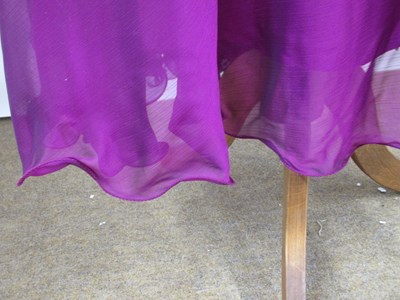 Lot 85 - A fuschia chiffon overlay skirt with ruffle...