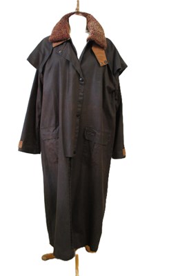 Lot 145 - Toggi: a brown wax coat, with storm flap,...