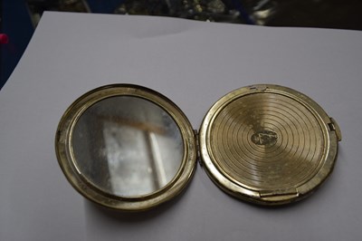 Lot 127 - A silver mounted powder compact with engine...
