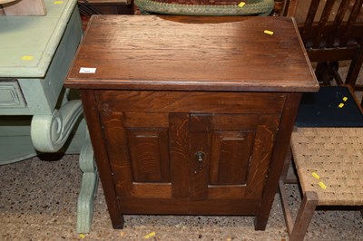 Lot 324 - An oak two door cupboard