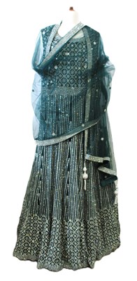 Lot 120 - An Indian rhinestone dress by Seher, the green...