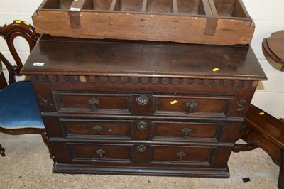 Lot 357 - An oak mitred front three drawer chest on casters