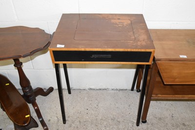 Lot 360 - A vintage sewing machine in cabinet