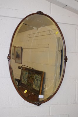Lot 222 - An early 20th Century wall mirror in oval...