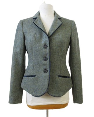 Lot 98 - A green tweed jacket by Katherine Hooker, with...