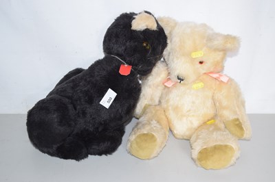 Lot 500 - A vintage teddy and a soft toy cat