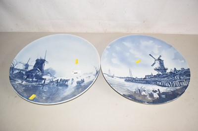 Lot 509 - Pair of modern Delft chargers decorated with...