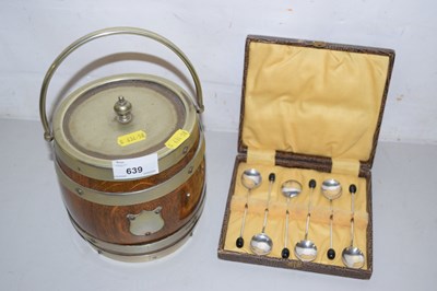 Lot 639 - An oak biscuit barrel and a case of coffee spoons