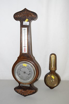 Lot 676 - Two oak cased barometers