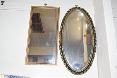 Lot 743 - An oval wall mirror in moulded frame together...