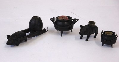 Lot 256 - Three carved bog oak thinble holders and a...