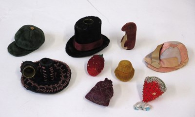 Lot 273 - A group of fabric pincushions and thinble...