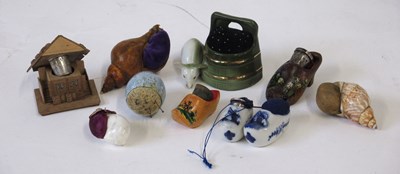 Lot 274 - A group of pincushions and thimble holders,...