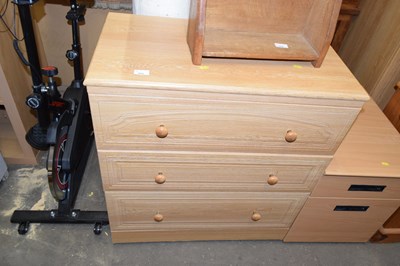 Lot 855 - A light wood finish three drawer chest
