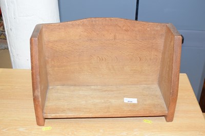 Lot 856 - An oak book rack