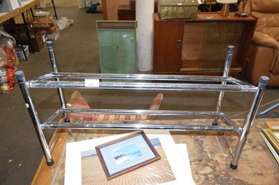 Lot 879 - A chrome finish shoe rack