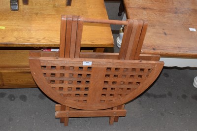 Lot 894 - A folding hardwood garden table