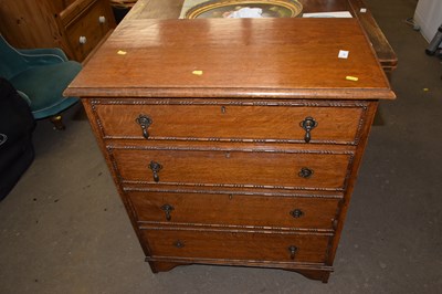 Lot 771 - An early 20th Century oak four drawer chest...