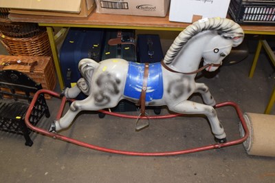 Lot 799 - A vintage moulded plastic rocking horse on...