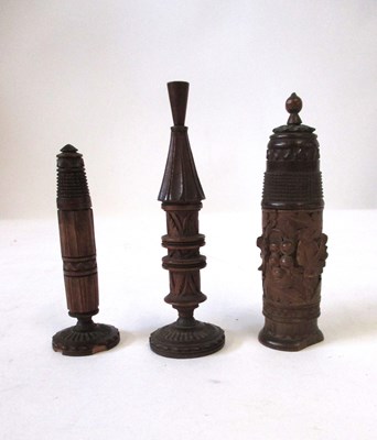 Lot 243 - Three carved wooden freestanding needle / ...