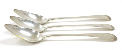 Lot 17 - Three George III silver serving spoons,...