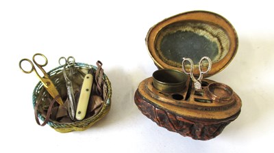 Lot 267 - A walnut needlework accessory, the hinged...