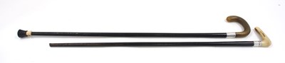 Lot 50 - Two vintage walking sticks with silver bands,...