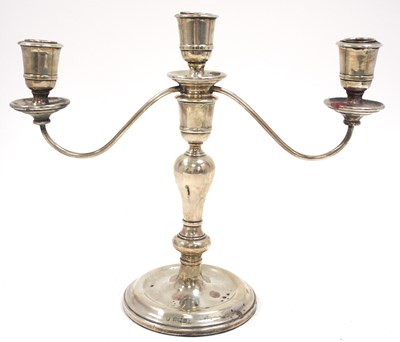 Lot 54 - An Elizabeth II silver three light candelabra,...