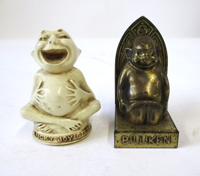 Lot 259 - Two Billiken novelty tape measures, including...
