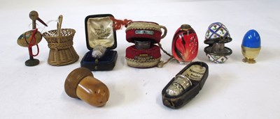 Lot 248 - A group of thimbles and holders, including two...