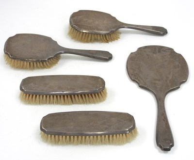 Lot 56 - An Art Deco silver backed dressing table set...