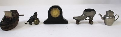 Lot 265 - Five novelty tape measures, including a black...