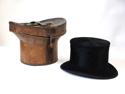 Lot 290 - A black silk top hat, inner circumference...