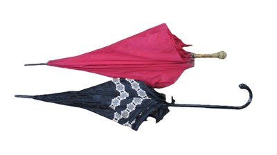 Lot 196 - Two parasols, one in black satin with lace...