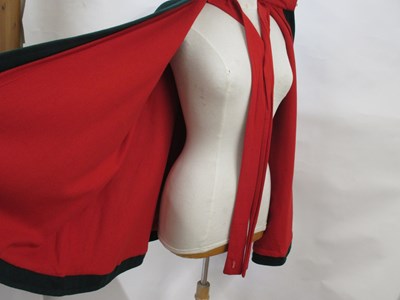 Lot 22 - A 1960's nurses cape, in green wool with red...
