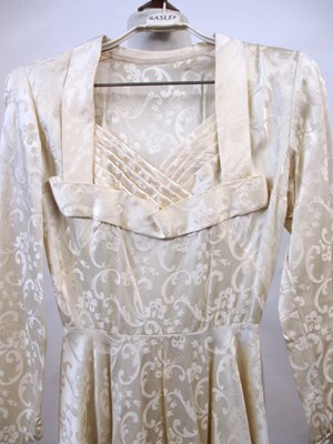 Lot 23 - A 1940's cream patterned satin wedding...