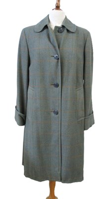 Lot 141 - Aquascutum: a shower proof wool check coat,...