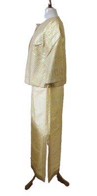 Lot 91 - A buttermilk yellow silk two piece by Gosden,...
