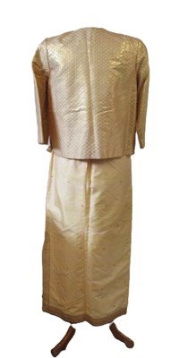Lot 91 - A buttermilk yellow silk two piece by Gosden,...