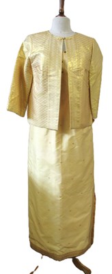 Lot 91 - A buttermilk yellow silk two piece by Gosden,...
