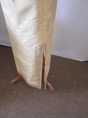 Lot 91 - A buttermilk yellow silk two piece by Gosden,...