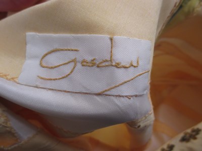 Lot 91 - A buttermilk yellow silk two piece by Gosden,...
