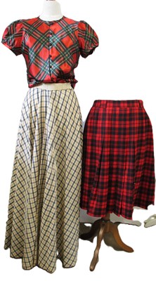 Lot 86 - A tartan pleated skirty by Jobis (estimated...