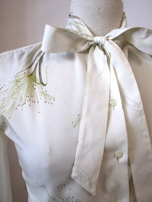 Lot 90 - A cream printed pussy bow blouse by Pastella...